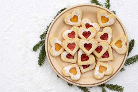 Homemade linzer cookies filled with strawberry and apricot yamの写真素材