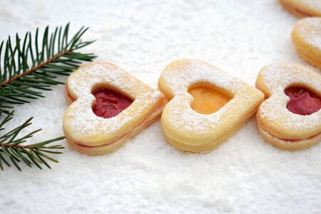 Homemade linzer cookies filled with strawberry and apricot yam
