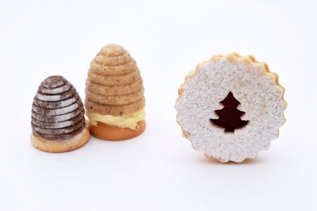 Two kinds of christmas cookies - wasp nests and linzer cookiesの写真素材