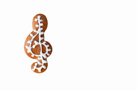 Gingerbread treble clef isolated on whiteの写真素材