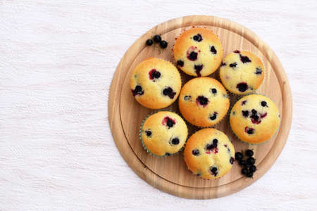 Summer baking - delicious homemade muffins with black currantの写真素材