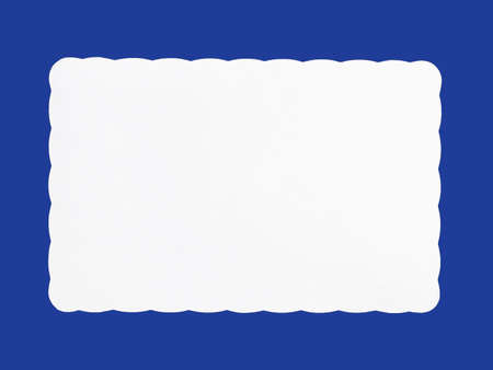 Blank white decorative paper isolated on blue background, copy space for text