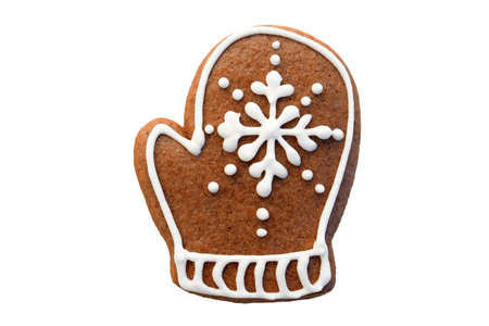 Gingerbread glove decorated with white icing, isolated on white background