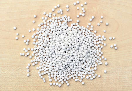 Dry tapioca pearls on light background, top view