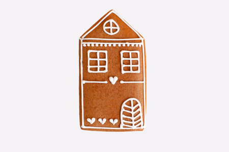 Romantic gingerbread house isolated on white background