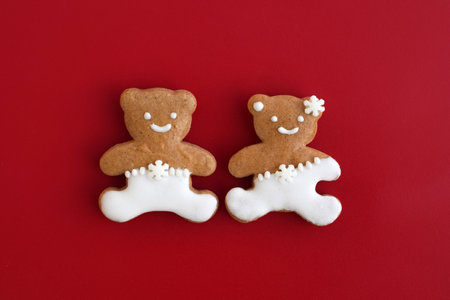 Cute gingerbread bears on a red backgroundの写真素材