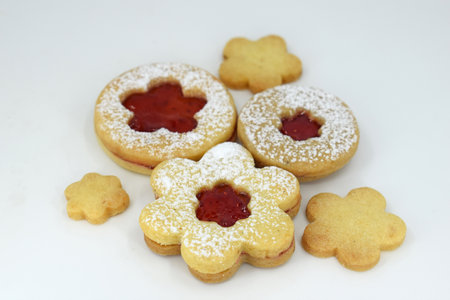 Linzer cookies on a white background, flowers and round shape
