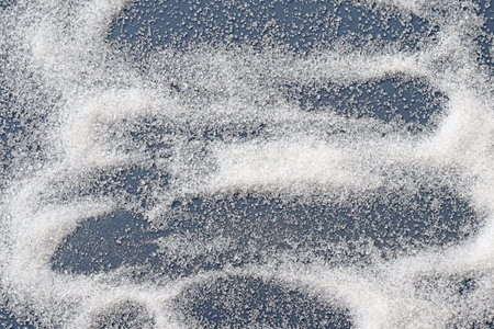 White caster sugar on a blue backgroundの写真素材