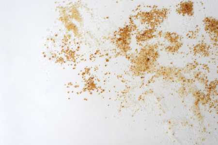 Sugar of more colors and different crystal size on a white background, copy space for textの写真素材