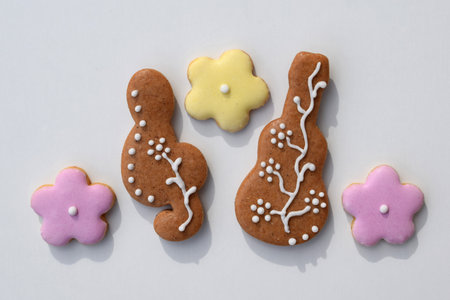 Romantic decorated gingerbread cookies in a shape of guitar, treble clef and flowers, white