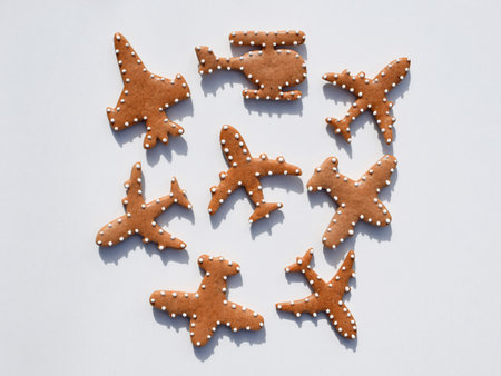 Gingerbread cookies in a shape of airplanes and helicopter, white backgroundの写真素材