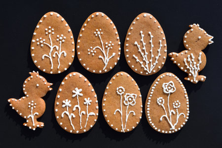 Romantic decorated Easter gingerbread cookies in a shape of egg and chickenの写真素材