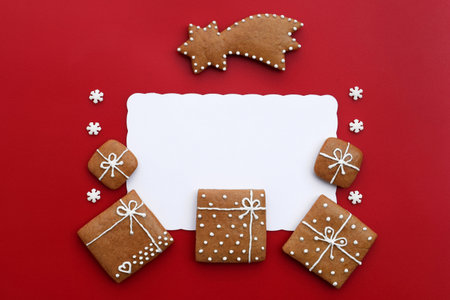 Decorated gingerbread cookies - christmas presents and comet with small sugar snowflakes, white space for textの写真素材