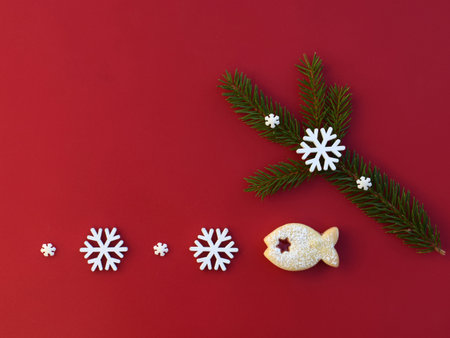 Christmas composition with linzer cookie in a shape of fish, spruce twig and snowflakes, copy space for textの写真素材