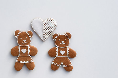 Gingerbread bears and heart decorated with white icing, copy space for text