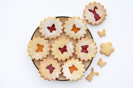 Homemade Linzer cookies with strawberry and apricot jam. Easter baking