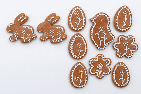 Romantic decorated Easter gingerbread cookies of various shapes, white background, copy space for textの写真素材