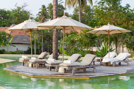 beach chairs on the poolの写真素材