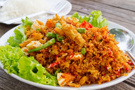 deep fired fish mixed with spicy sauce の写真素材