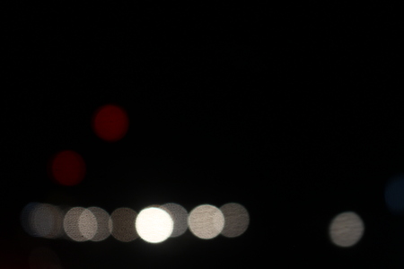 Light blur and bokeh with defocused  black backgroundの写真素材
