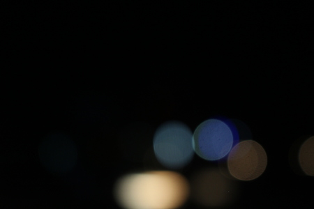 City night light blur and bokeh with defocused  black backgroundの写真素材