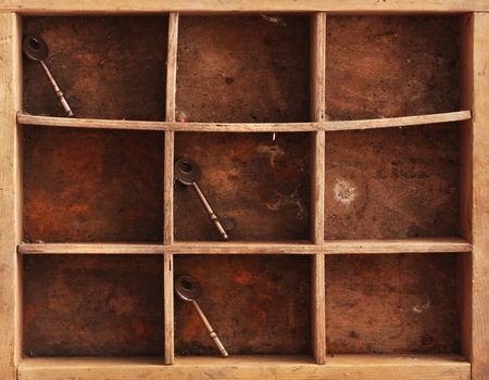 a still life composition with old dusty shelves whith three keys and a rusty chainの写真素材