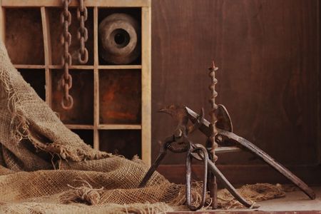 a still life composition with old dusty objects on wood backgroung, empty space for textの写真素材