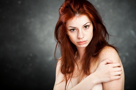 beautiful woman portrait with red hair and frecklesの写真素材