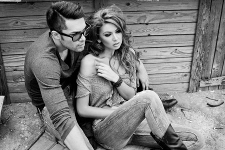 Sexy and stylish young couple wearing jeans  Photo has an intentional film grain  の写真素材