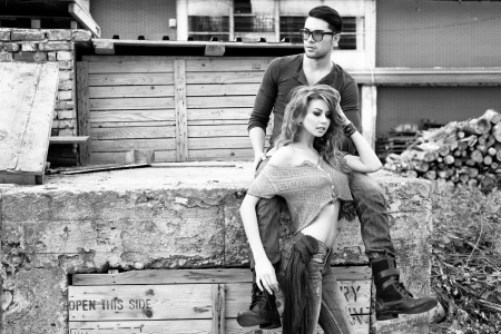 Sexy and stylish young couple wearing jeans  Photo has an intentional film grain  の写真素材