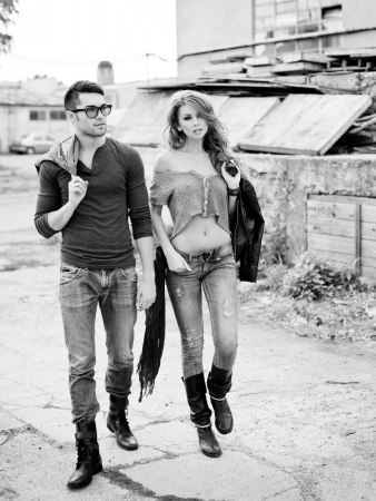 Sexy and stylish young couple wearing jeans  Photo has an intentional film grain  の写真素材