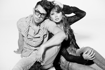 Sexy man and woman doing a fashion photo shoot in a professional studio - bw retro moodの写真素材