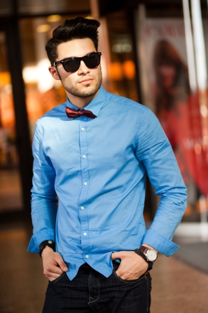 attractive young male fashion model dressed casual - outdoorの写真素材