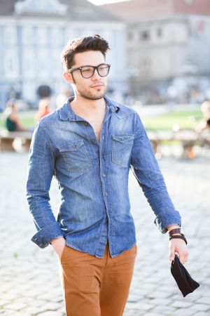 handsome young man posing outdoorsの写真素材