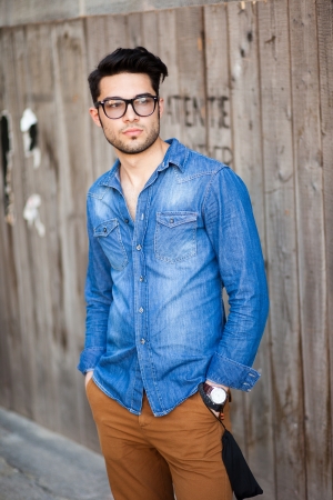 handsome young man posing outdoorsの写真素材
