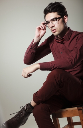 handsome male model dressed elegant posing in the studio looking seriousの写真素材