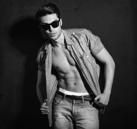 Vintage stylized black and white photo of young male model (Photo has an intentional film grain) の写真素材
