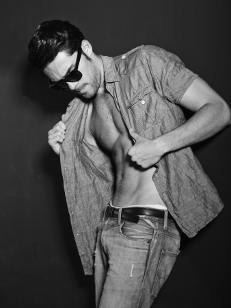 Vintage stylized black and white photo of young male model (Photo has an intentional film grain) の写真素材