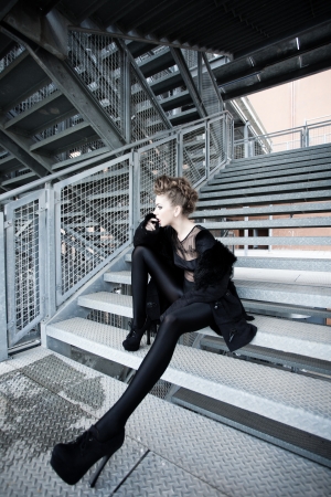 sexy woman model, great body doing a fashion shoot in a grunge locationの写真素材