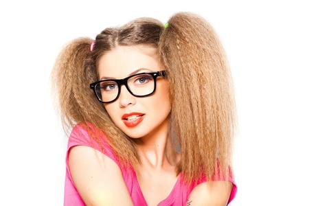 curly girl with hipster glasses and two tails isolated on white の写真素材