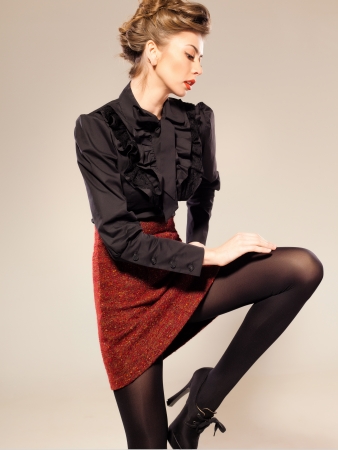 sexy woman model dressed elegant doing a fashion shoot in the studioの写真素材