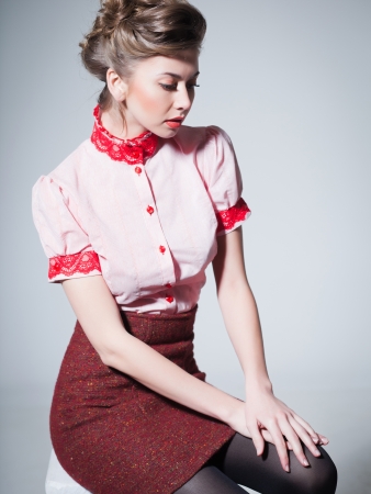 sexy woman dressed retro doing a pin -up fashion shoot in the studioの写真素材