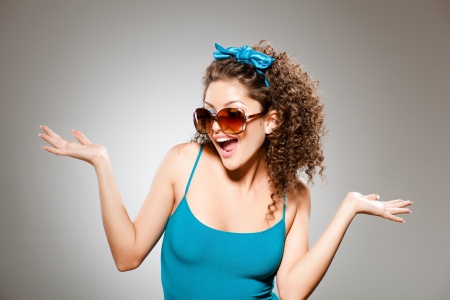 pretty girl with curly hair and perfect teeth の写真素材