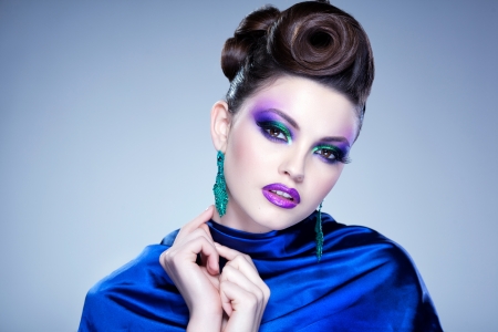 professional blue make-up and hairstyle on beautiful woman face - studio beauty shotの写真素材