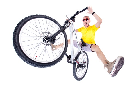 crazy boy on a dirt jump bike isolated on white - wide studio shot crazy boy on a dirt jump bike isolated on white - wide studio shot