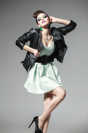 beautiful woman posing in a leather jacketの写真素材