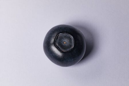 A ripe blueberry on a white background.の写真素材