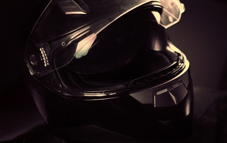 Black motorcycle helmet with nice lightingの写真素材