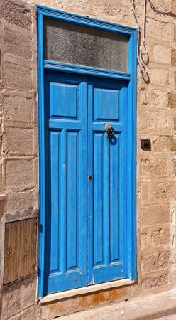 characteristic doors in the historic center of Favignanaの写真素材