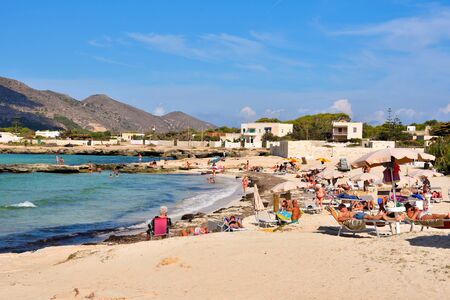 panorama of the coast of the island and tourists and bathers on the cliff September 26 2019 Favignana Sicily Italyのeditorial素材